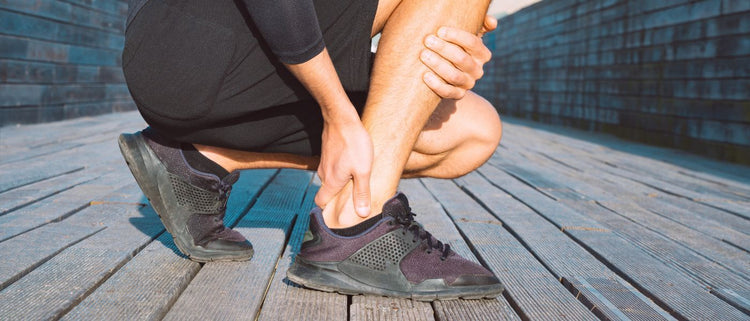 Blog of How I Healed from My Achilles Surgery in Record Time (Without Spending $1 Million Like Aaron Rodgers) which have image person holding Achilles tendon