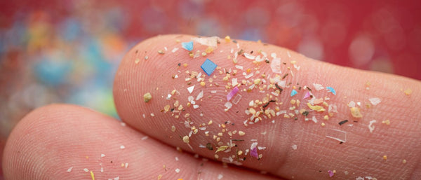 microplastic particles mixed in sand