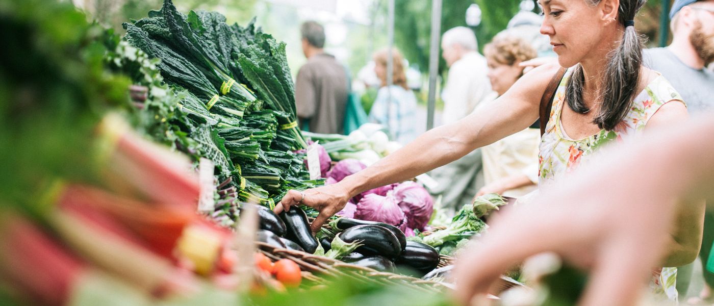 woman looking at vegetables