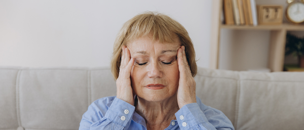 Woman holding her head