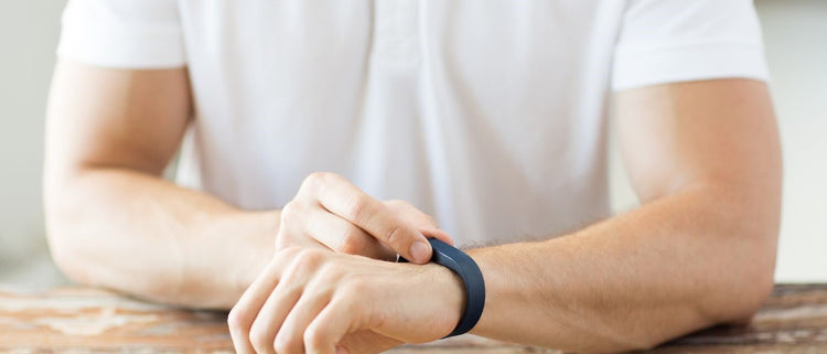 Blog of Finding the Root Cause of POTS: Using Holistic Intervention to Get Your Life Back on Track which have image man checking his fitbit