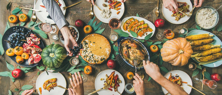 Blog of 9 Ways to Support Your Digestion During the Holidays which have image table of holiday foods