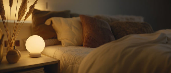 warm light next to a bed