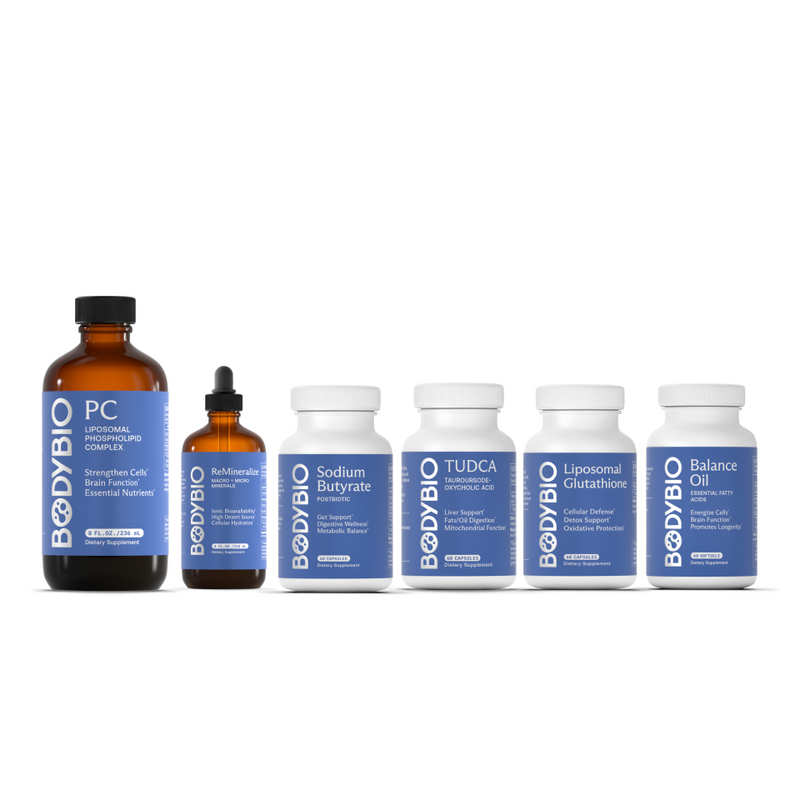 Six bottles from The Cell Detox Protocol—featuring PC, ReMineralize, Sodium Butyrate, TUDCA, Liposomal Glutathione, and Balance Oil—are lined up in a row on a white background.